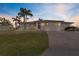 Modern home exterior with palm trees and driveway at 2820 Marlin Court, Punta Gorda, FL 33950