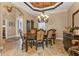 Elegant dining room with chandelier and large dining table at 2895 Mill Creek Rd, Port Charlotte, FL 33953