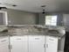 Modern kitchen with granite countertops and stainless steel appliances at 3324 Avanti Cir, North Port, FL 34287