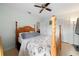 Bedroom with a wooden bed frame and coastal-themed bedding at 3343 Sorrel St, Port Charlotte, FL 33981