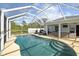 Refreshing screened-in pool, perfect for relaxation at 3343 Sorrel St, Port Charlotte, FL 33981