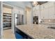 Open concept kitchen with stainless steel appliances and a large island at 3401 Sandpiper Dr, Punta Gorda, FL 33950