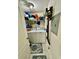 Bright laundry room with washer, dryer and ample shelving at 4178 Central Sarasota Pkwy # 326, Sarasota, FL 34238