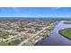 An aerial view of a house nestled in a community by the water at 4368 Flamingo Blvd, Port Charlotte, FL 33948