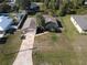 One-story house, palm tree, and geometric driveway at 4605 Midland St, North Port, FL 34288