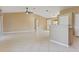 Spacious living room with tile floors and ceiling fan at 4605 Midland St, North Port, FL 34288