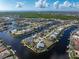 An aerial view of a luxurious waterfront home with a large lot and pool at 500 Andora Dr, Punta Gorda, FL 33950