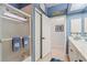 Clean bathroom with a shower and updated white cabinets at 500 Andora Dr, Punta Gorda, FL 33950