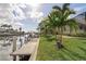 Landscaped waterfront lot with private dock providing direct canal access at 500 Andora Dr, Punta Gorda, FL 33950