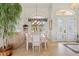Spacious dining area with large windows and elegant chandelier at 500 Andora Dr, Punta Gorda, FL 33950