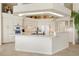 Large kitchen with island, white cabinetry and tile flooring at 500 Andora Dr, Punta Gorda, FL 33950