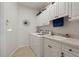 Laundry room with washer, dryer and cabinets at 500 Andora Dr, Punta Gorda, FL 33950
