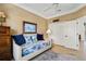 Office with daybed, built in shelving and ceiling fan at 500 Andora Dr, Punta Gorda, FL 33950