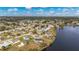 Aerial view highlighting a house's waterfront location and neighborhood at 5032 Koli Ct, North Port, FL 34287