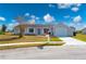 Newly painted house exterior with gray walls, attached garage and mailbox at 5032 Koli Ct, North Port, FL 34287