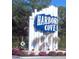 Entrance sign for Harbor Cove, showcasing a coastal aesthetic with nautical elements and greenery at 525 Parkwood Ave, North Port, FL 34287