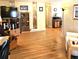 Bright living room with wood-look floors, television, and traditional furniture at 525 Parkwood Ave, North Port, FL 34287