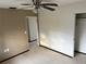 Bright bedroom with ceiling fan and ample closet space at 627 Palm Ave, Punta Gorda, FL 33950