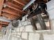 Old compressor and air tank in garage ceiling at 627 Palm Ave, Punta Gorda, FL 33950