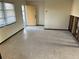 Large living room with terrazzo flooring and plenty of natural light at 627 Palm Ave, Punta Gorda, FL 33950