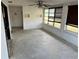 Sunroom with large windows, ceiling fan, and concrete floor at 627 Palm Ave, Punta Gorda, FL 33950