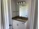 Bathroom featuring granite counters and decorative lighting at 9506 Melody Cir, Port Charlotte, FL 33981