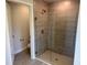 Bathroom featuring a frameless shower with tiled walls, and tiled flooring at 9506 Melody Cir, Port Charlotte, FL 33981