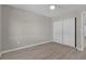 Well-lit bedroom with double door closet and wood-look floors at 951 Webster Nw Ave, Port Charlotte, FL 33948