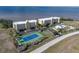Community overview featuring tennis courts, pool, and water views at 101 N Marion Ct # 225, Punta Gorda, FL 33950