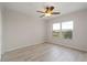 Spacious bedroom with ceiling fan and large window at 101 N Marion Ct # 225, Punta Gorda, FL 33950