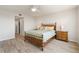 Cozy bedroom with wooden furniture and access to balcony at 101 N Marion Ct # 225, Punta Gorda, FL 33950
