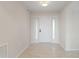 Clean and bright entryway with tile floors and white door at 101 N Marion Ct # 225, Punta Gorda, FL 33950