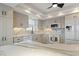 Modern kitchen with white cabinets, granite counters, and stainless steel appliances at 101 N Marion Ct # 225, Punta Gorda, FL 33950