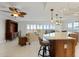 Open kitchen with island, white cabinets, and ocean view at 101 N Marion Ct # 225, Punta Gorda, FL 33950