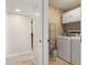 Laundry room with washer, dryer, shelving, and extra storage at 101 N Marion Ct # 225, Punta Gorda, FL 33950