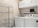 Well-equipped laundry room with washer, dryer, and storage at 101 N Marion Ct # 225, Punta Gorda, FL 33950