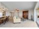 Living room with beige sofa, wood cabinet, and tiled floors at 101 N Marion Ct # 225, Punta Gorda, FL 33950