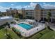 Community pool with lounge chairs and patio area at 101 N Marion Ct # 225, Punta Gorda, FL 33950