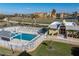 Inviting community pool with a relaxing patio and surrounding green space at 101 N Marion Ct # 225, Punta Gorda, FL 33950