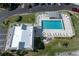 Community pool with plenty of lounge chairs and a shaded area at 101 N Marion Ct # 225, Punta Gorda, FL 33950