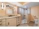 Walk-in shower with textured tile and glass enclosure at 101 N Marion Ct # 225, Punta Gorda, FL 33950