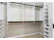 Large walk-in closet featuring ample shelving and hanging space at 101 N Marion Ct # 225, Punta Gorda, FL 33950
