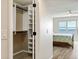Spacious walk-in closet with custom shelving and rods at 101 N Marion Ct # 225, Punta Gorda, FL 33950