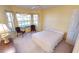 Bedroom with two chairs and large bay window at 10208 Arrowhead Dr, Punta Gorda, FL 33955