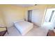 Bedroom with double closet and neutral decor at 10208 Arrowhead Dr, Punta Gorda, FL 33955