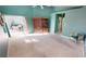 Bright bedroom with a large closet and patio access at 10208 Arrowhead Dr, Punta Gorda, FL 33955