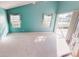 Relaxing bedroom with teal walls and access to a patio at 10208 Arrowhead Dr, Punta Gorda, FL 33955