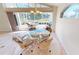 Charming dining area with glass table and view of patio at 10208 Arrowhead Dr, Punta Gorda, FL 33955