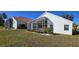 Well-maintained home with a large screened patio and lush lawn at 10208 Arrowhead Dr, Punta Gorda, FL 33955