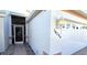 Front entrance with a screened door and a white exterior at 10208 Arrowhead Dr, Punta Gorda, FL 33955